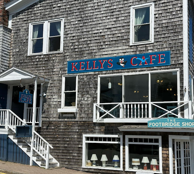 Cafe with blue sign and lamps
