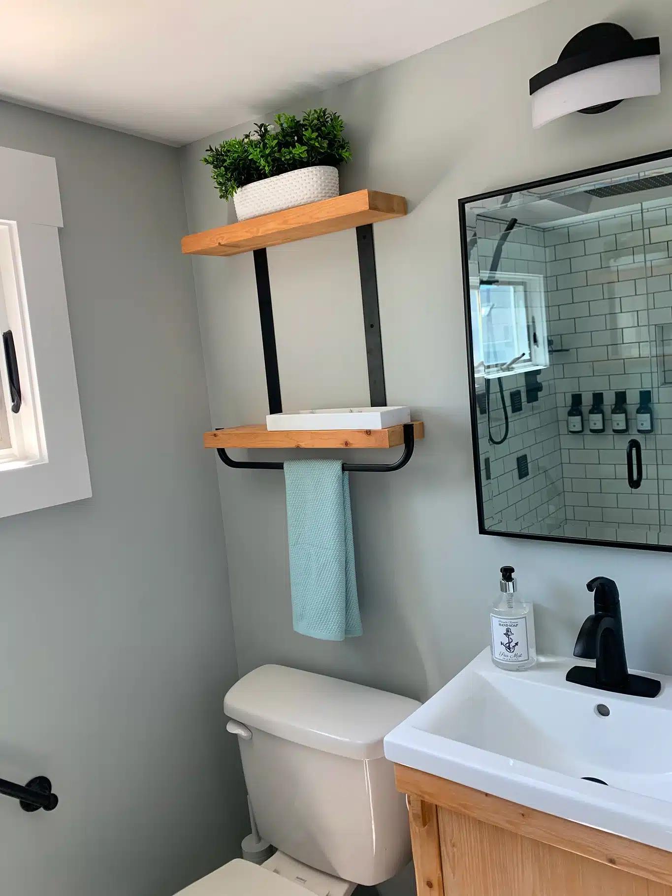Modern bathroom interior at The Helm House vacation home in Boothbay Harbor Maine
