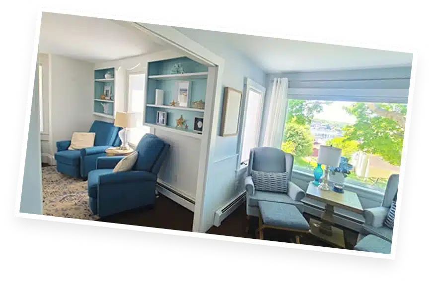 Cozy living room seating area at The Helm House in Boothbay Harbor Maine