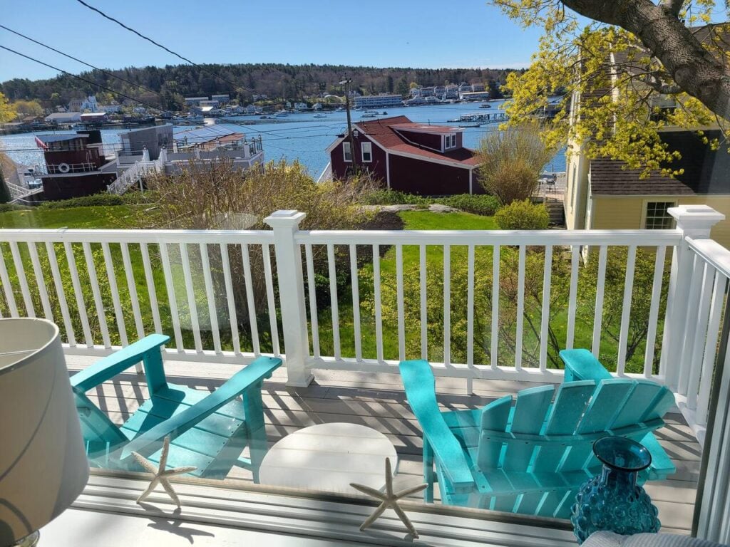 Bright balcony overlooking serene waterfront view