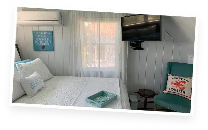 Cozy guest bedroom at The Helm House vacation home in Boothbay Harbor Maine