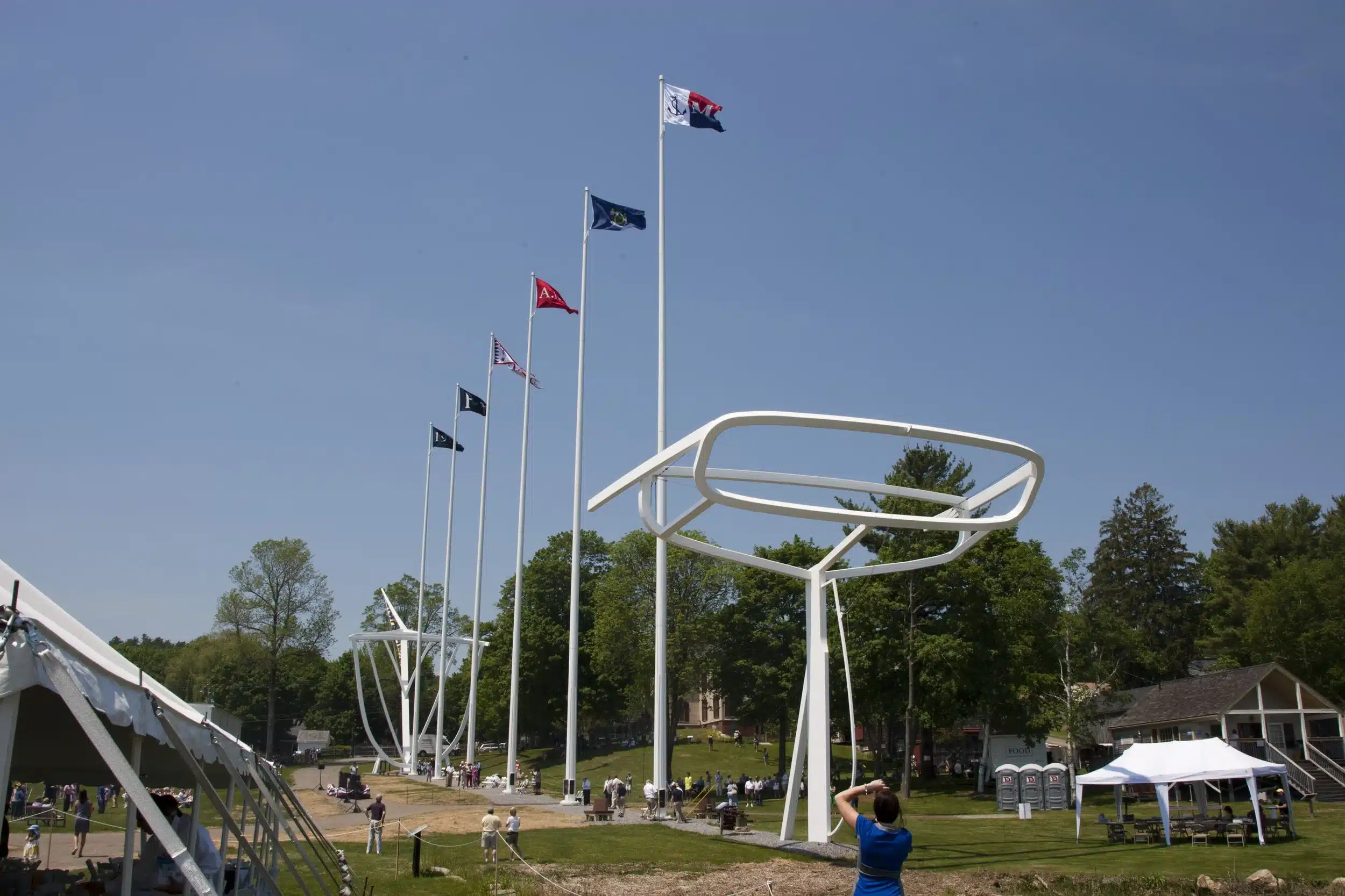 Tall flagpoles with various flags displayed.